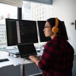 Developer wearing headphones working on a project