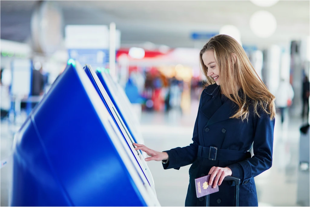 A woman checking in at a kiosk without any issues thanks to Right Click Tools Enterprise.